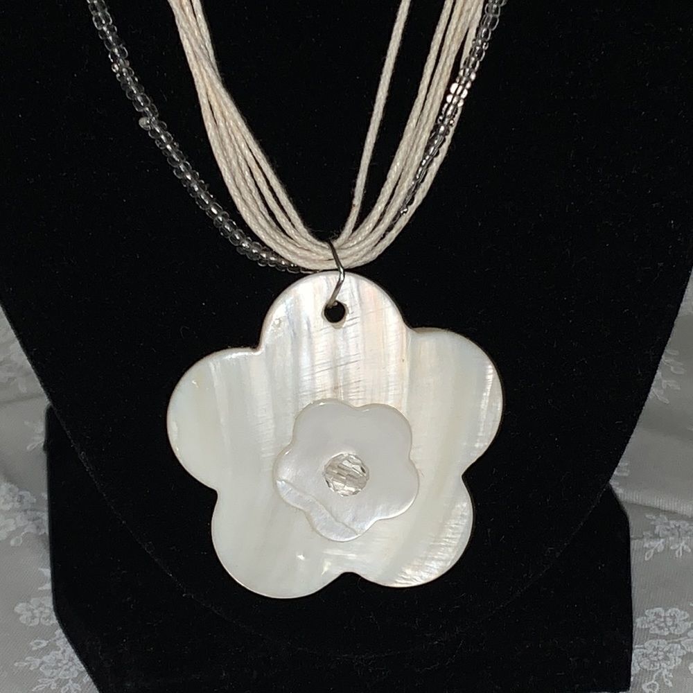 White carved shell necklace. 20”